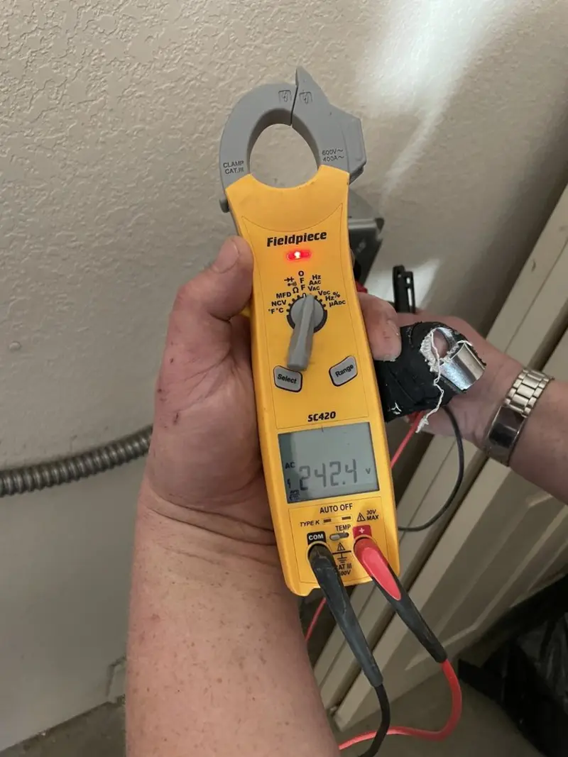 Voltage testing with clamp meter during Outlet Installation in Point Pleasant